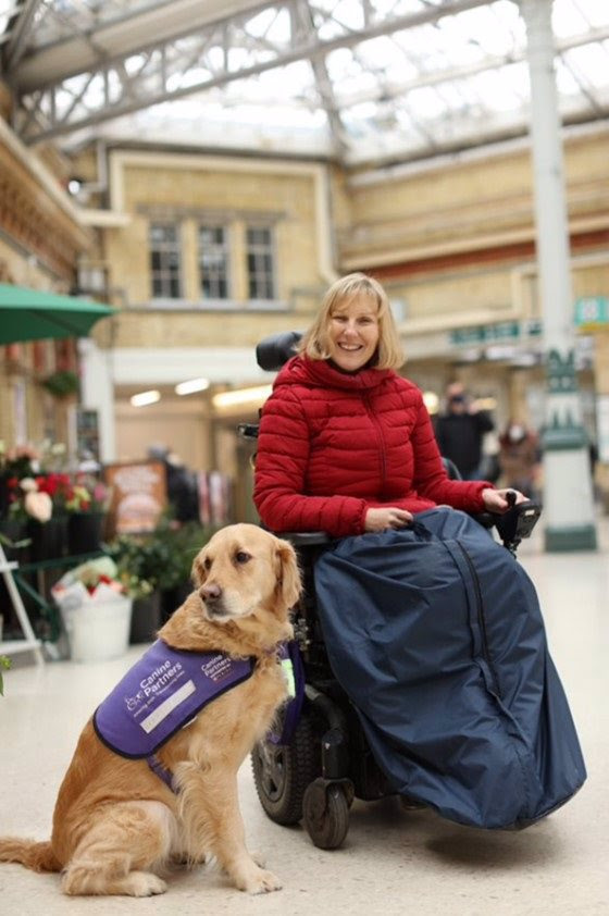 Photo of Fiona with her assistance dog